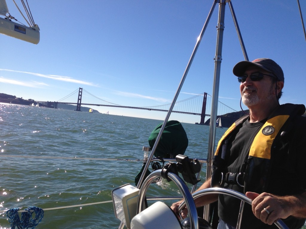 Rick at the helm with the Golden Gate Bridge in the background