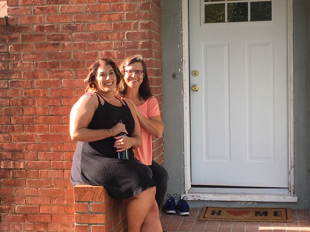 Niece Cara and Cindy in front of Cara's new house